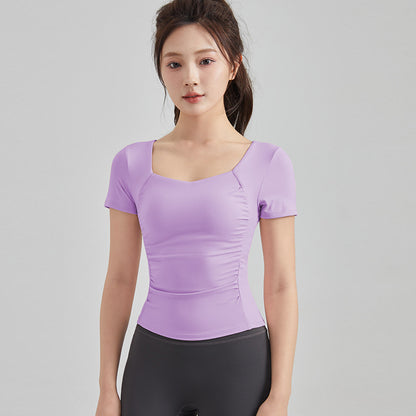 Haut de yoga à manches courtes — soutien-gorge rembourré pour un confort optimal