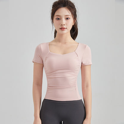 Haut de yoga à manches courtes — soutien-gorge rembourré pour un confort optimal