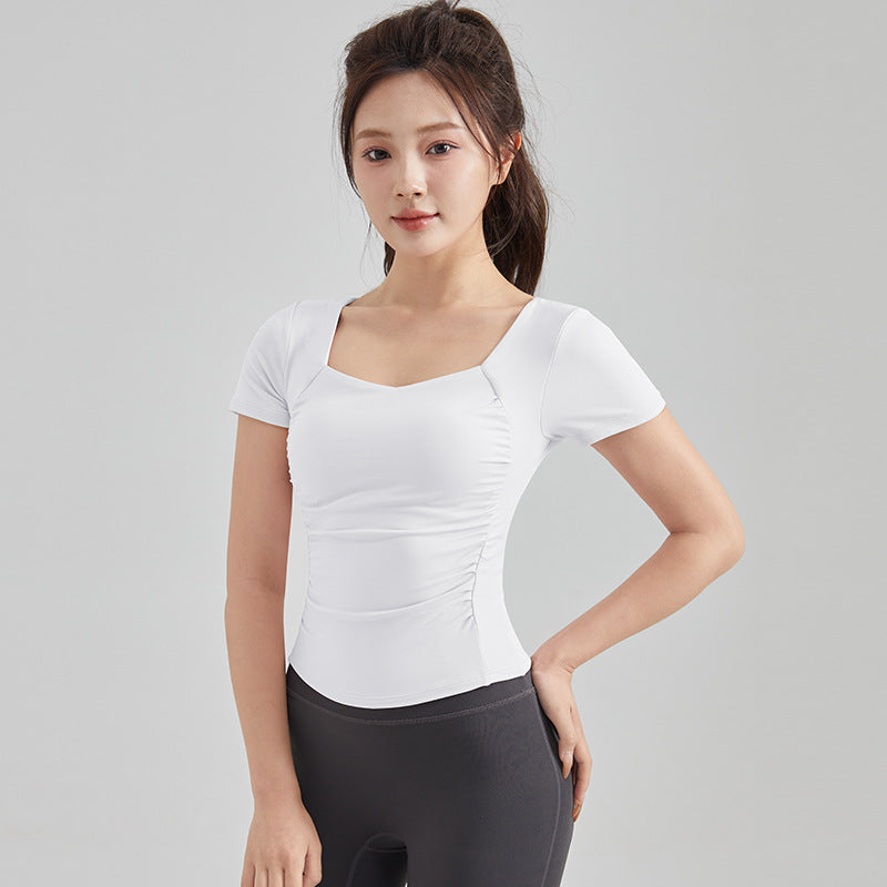 Haut de yoga à manches courtes — soutien-gorge rembourré pour un confort optimal