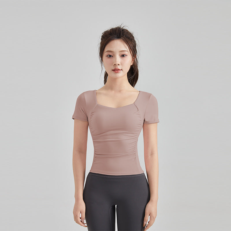 Haut de yoga à manches courtes — soutien-gorge rembourré pour un confort optimal
