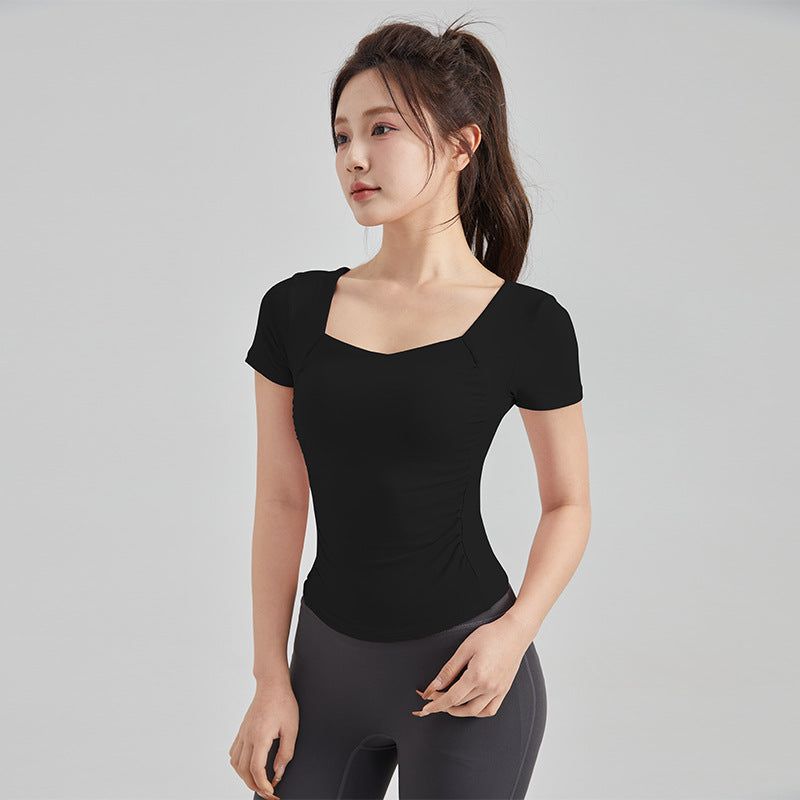 Haut de yoga à manches courtes — soutien-gorge rembourré pour un confort optimal